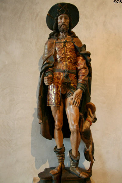 Gilded wood carving of St. Roch with dog (early 16th C) from Normandy, France at The Cloisters. New York, NY.