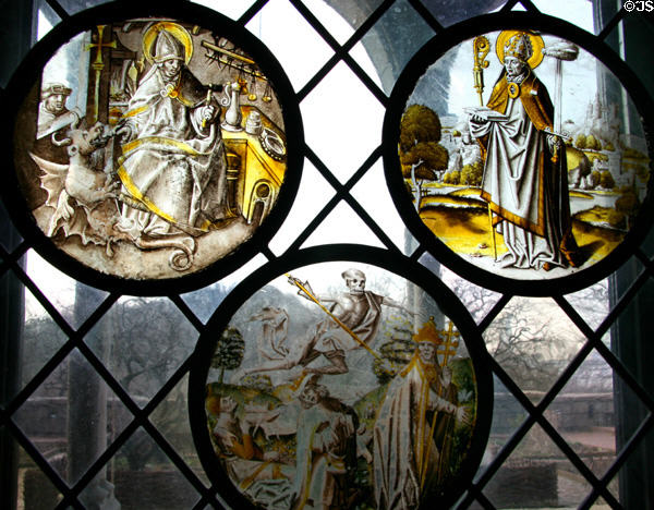 St Dunstan of Canterbury, St Lambrecht of Maastricht, & Vanitas stained glass windows (c1510-20) from the Lowlands at The Cloisters. New York, NY.