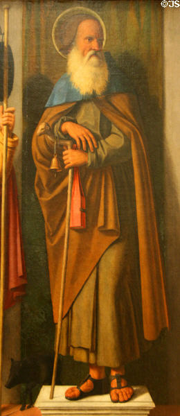 St. Anthony Abbot carrying bell & with pig detail of Three Saints painting (c1513) by Giovanni Battista Cima at Metropolitan Museum of Art. New York, NY.