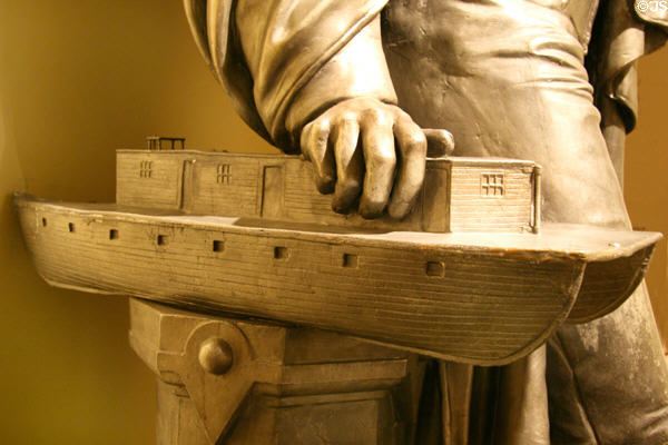 Detail of Robert Fulton statue with model of Manhattan-Brooklyn ferry boat Nassau (1814) at Museum of the City of New York. New York, NY.