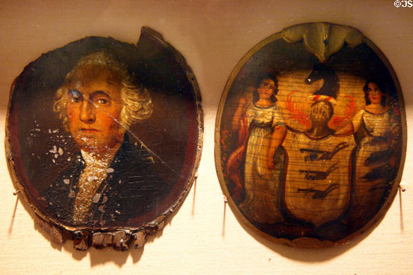 Early painted shields of New York fire units including one with picture of George Washington at New York Fire Museum. New York, NY.