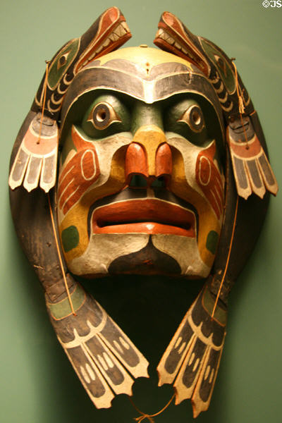 Kwakwaka'wakw mask of two sea lions around ancestor face (1880-1920) at National Museum of American Indian. New York, NY.