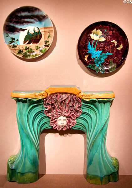 Earthenware dishes (c1885-90 & c1870-80) by Théodore Deck over Art Nouveau fireplace surround (c1900) attrib. Désiré Muller all of France at Metropolitan Museum of Art. New York, NY.