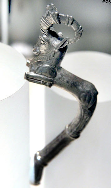 Egyptian silver vessel handle in shape of bounding ibex in Persian style (late 5th C BCE) probably from Tell el-Maskhuta, Egypt at Brooklyn Museum. Brooklyn, NY.