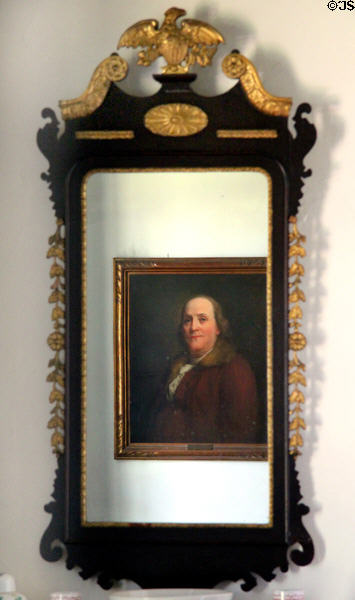 Portrait of Benjamin Franklin reflected in early American mirror at Conference House. Staten Island, NY.