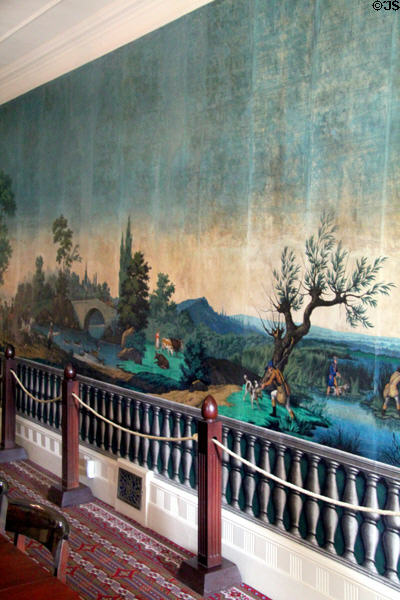 Restored original French wallpaper (1830-40) "Paysages à Chasse" scenic hunting scenes by Zuber Cie. over fake balustrade wallpaper by Jacquemart et Bernard with some infill reproduction sections in dining room at Lindenwald. Kinderhook, NY.