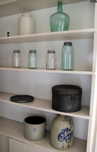 Kitchen shelving with glass canning jars, stoneware crocks & other vessels at Lindenwald. Kinderhook, NY.