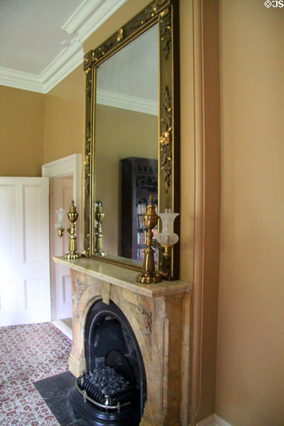 Marble fireplace in library with mirror & Argand lamps at Lindenwald. Kinderhook, NY.