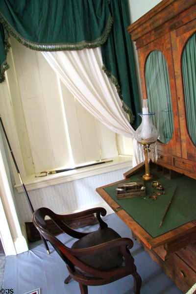 Secretary-bookcase, late classical style, (1830-50) & armchair in Martin Van Buren's bedroom at Lindenwald. Kinderhook, NY.