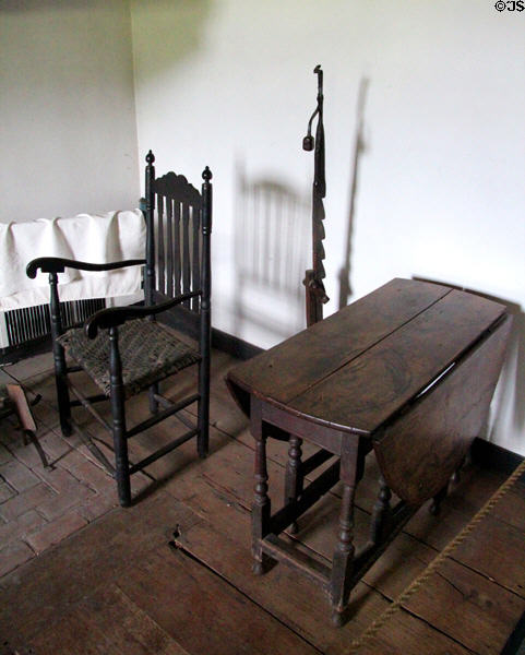 Drop-leaf table, arm chair & adjustable height candlestick in Schenck House at Old Bethpage Village. Old Bethpage, NY.