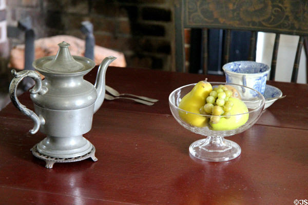 Metal teapot & glass bowl in Conklin House at Old Bethpage Village. Old Bethpage, NY.
