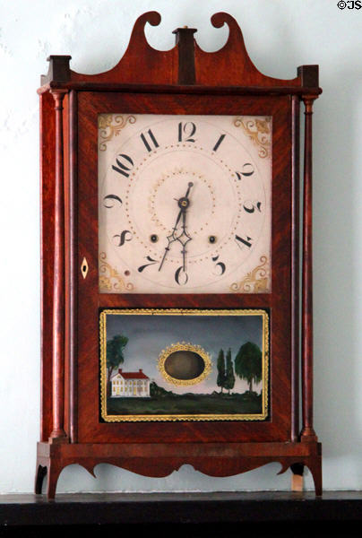 Mantle clock with manor house scene in Kirby House at Old Bethpage Village. Old Bethpage, NY.