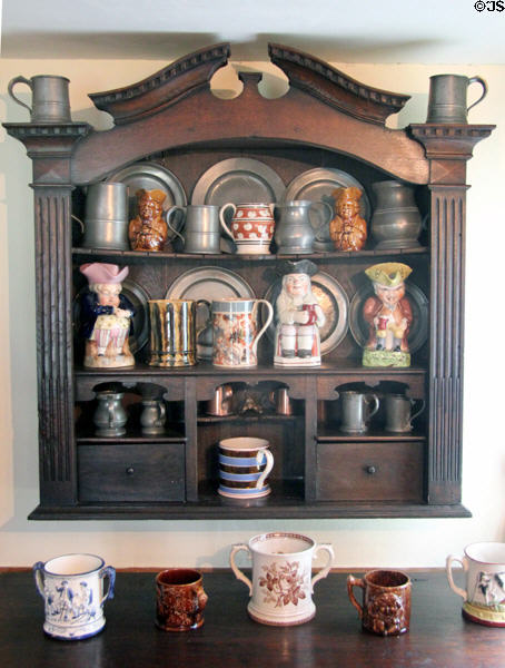 Wall cupboard with pewter, lusterware & Toby jug display at Home Sweet Home Museum. East Hampton, NY.