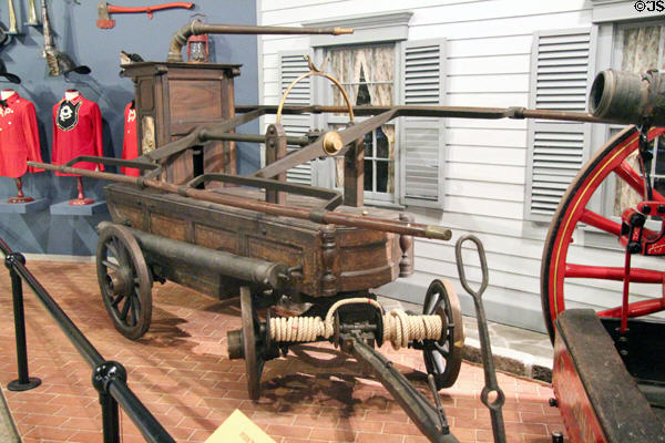 Gooseneck pumper (1807) originally used to fight fires in New York City was operated by six men on each side at carriage collection of Long Island Museum. Stony Brook, NY.