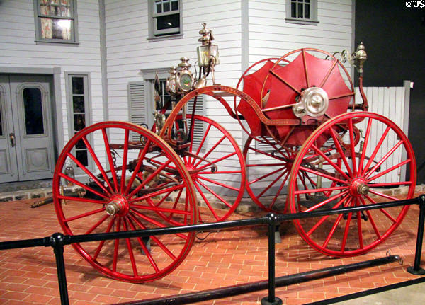 Firefighting four-wheeled "spider" hose cart (1870) at carriage collection of Long Island Museum. Stony Brook, NY.