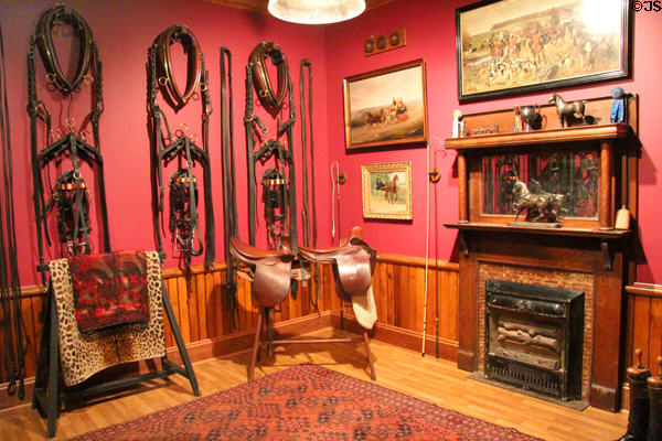 Tack room with fireplace to keep leather harnesses & saddles dry at carriage collection of Long Island Museum. Stony Brook, NY.