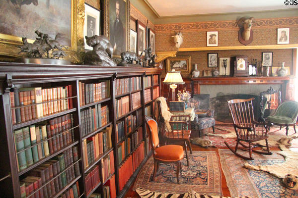 Library bookshelves & fireplace at Roosevelt's House Sagamore Hill NHS. Cove Neck, NY.