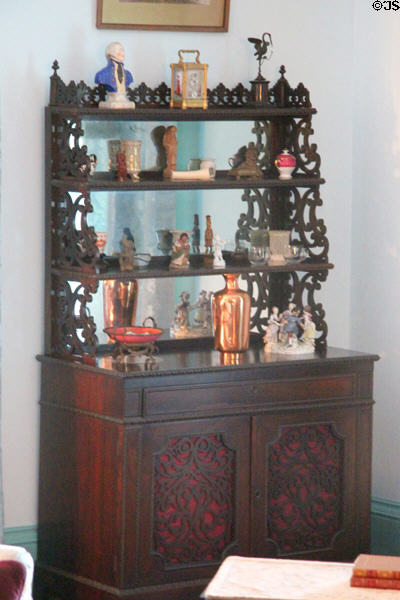 Cabinet with display shelves in Edith's drawing room at Roosevelt's House Sagamore Hill NHS. Cove Neck, NY.