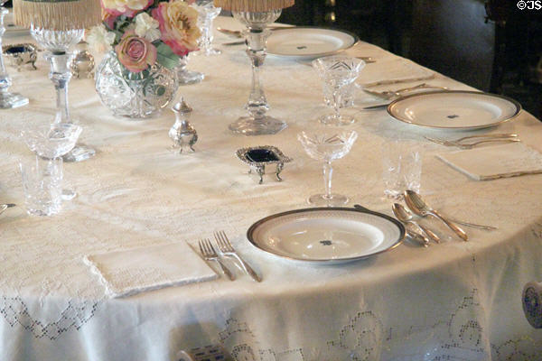 Table setting with Royal Crown Derby China plates also used in White House in dining room at Roosevelt's House Sagamore Hill NHS. Cove Neck, NY.