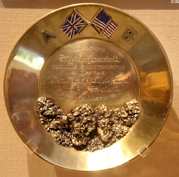 Golden gold miner's pan with nuggets presented to President Roosevelt by Arctic Brotherhood in Alaska (1903) at Old Orchard Museum at Sagamore Hill NHS. Cove Neck, NY.