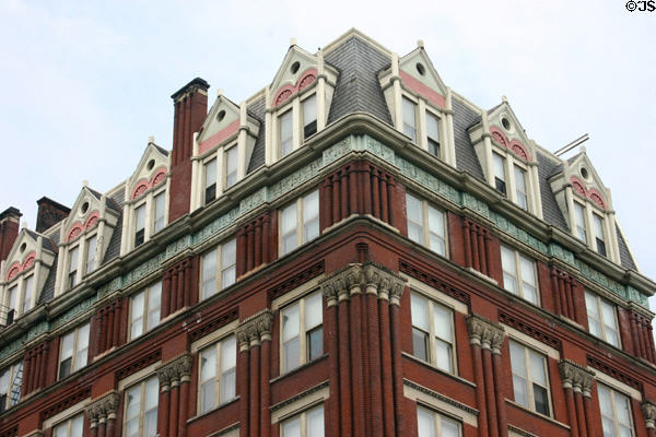 Elaborate facade of building with brick columns (208 8th St.). Cincinnati, OH.