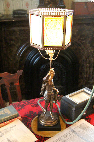 Gas lamp supported by bronze hunter & with lithophane glass shade at Taft House NHS. Cincinnati, OH.
