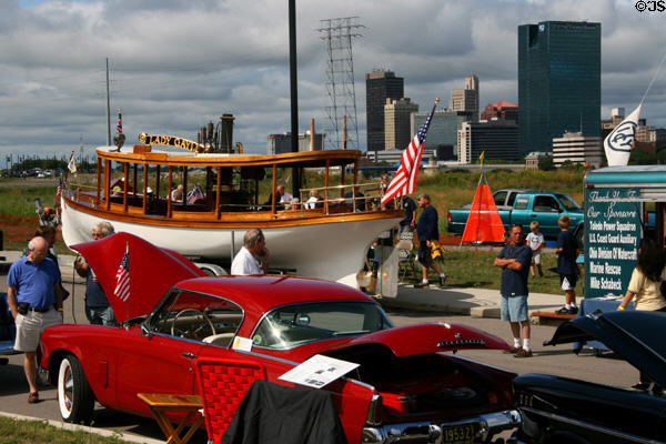 Antique boat & car rally against skyline of Toledo. Toledo, OH.