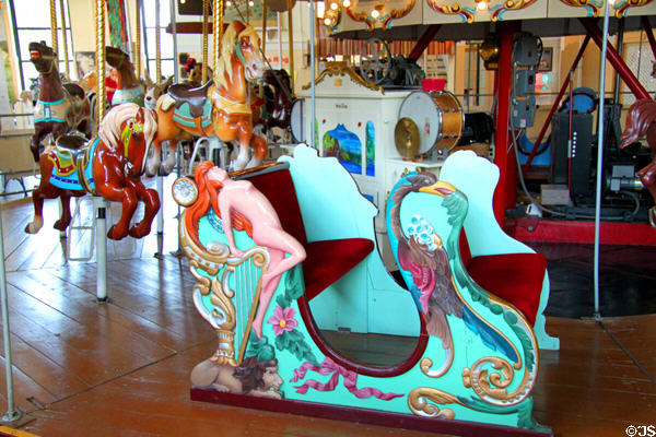 Woman on harp on carousel chariot at Merry-Go-Round Museum. Sandusky, OH.