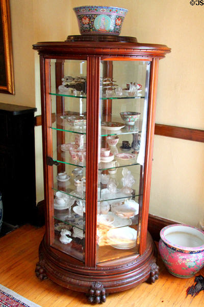 Glass & china collection in hexagonal china cabinet (c1900) in Jewett House at Oberlin Heritage Center. Oberlin, OH.