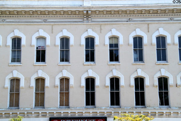 Heritage Italianate block with horseshoe window surrounds (419 Broad St.). Elyria, OH.