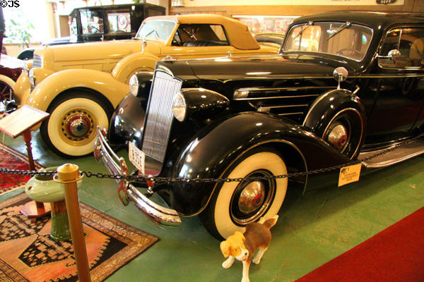 Packard Fifteenth Series, 1508 Invalid Sedan (1937) equipped with factory wheel chair fitted for right rear seat from Detroit, MI & Lincoln Model K, Series 300 convertible coupe (1936) in background at Canton Classic Car Museum. Canton, OH.