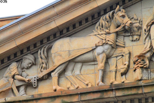 Pediment of Stark County Courthouse with detail of horses pulling plow. Canton, OH.
