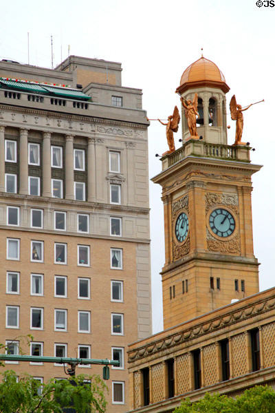 Clock tower of Stark County Courthouse with heralds blowing trumpets. Canton, OH.
