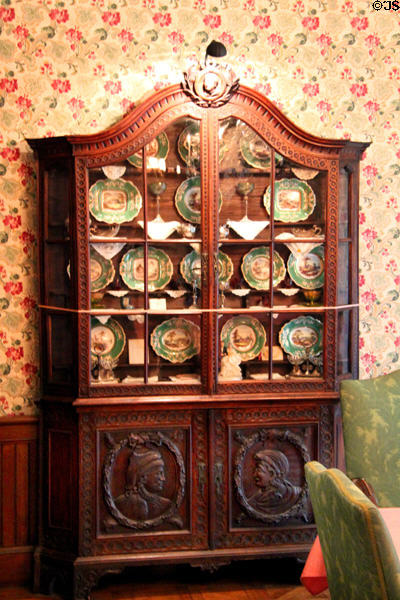 Dutch Renaissance vitrine containing English Tower Spode china in dining room at Hower House. Akron, OH.