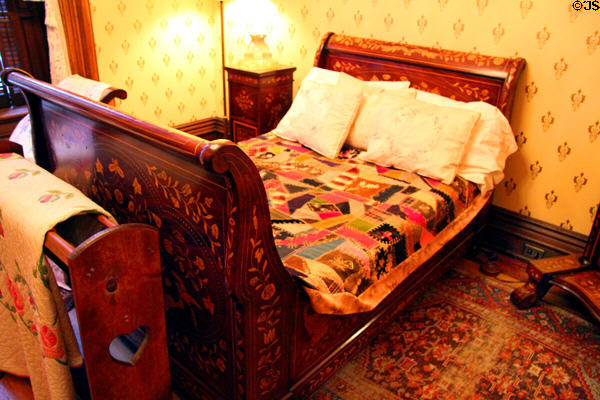French Empire Revival bedstead (aka sleigh bed) with crazy quilt at Hower House. Akron, OH.