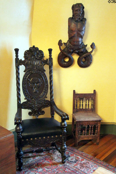 Carved wood merman (probably Spanish) & oak stained black chair in ballroom at Hower House. Akron, OH.