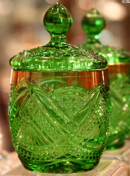 Pressed glass Fancy Loop (#1205) (1896-1905) mustard jar in emerald green at National Heisey Glass Museum. Newark, OH.
