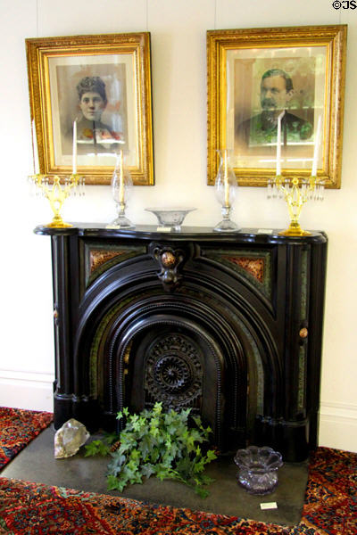 Susan Duncan Heisey & Augustus Henry Heisey portraits over fireplace in old house of National Heisey Glass Museum. Newark, OH.