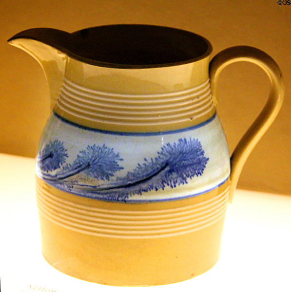 Yellow ware pitcher with blue seaweed decoration (1869-92) attrib. to McNicol & Burton at Museum of Ceramics. East Liverpool, OH.