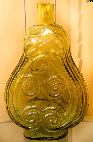 Yellow-green blown glass scroll flask (1822-35) attr: Crosby &. Shepard, Zanesville at Stone Academy Museum. Zanesville, OH.