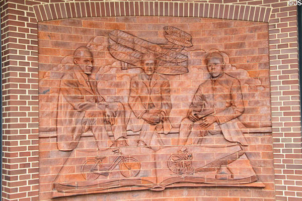 Relief mural showing Wright Brothers & poet Paul Dunbar at visitor center of Wright Cycle Co. shop. Dayton, OH.