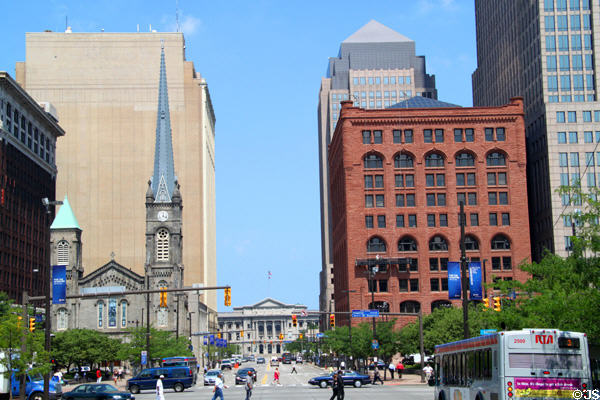 North side of Cleveland Public Square with Old Stone Church & Society National Bank framing Cuyahoga County Courthouse at end of street. Cleveland, OH. On National Register.