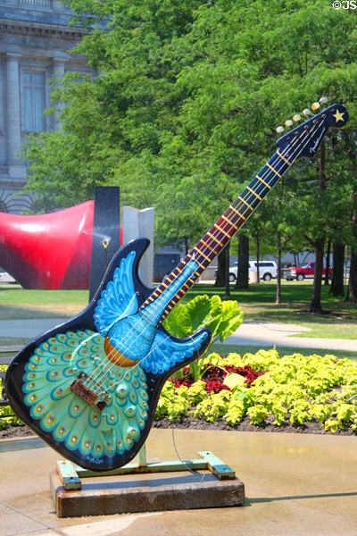 Cleveland Guitar Mania painted guitar (2002) shows peacock pattern by Martin Boyle. Cleveland, OH.