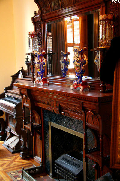 Fireplace with sconces in Parlor of Flavel House. Astoria, OR.