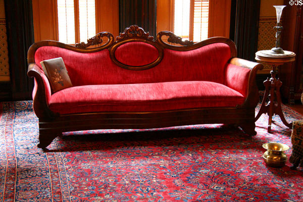Carved sofa in library of Flavel House. Astoria, OR.