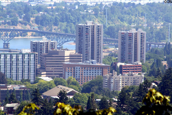 Residential towers at southern end of downtown Portland against Ross Island Bridge. Portland, OR.