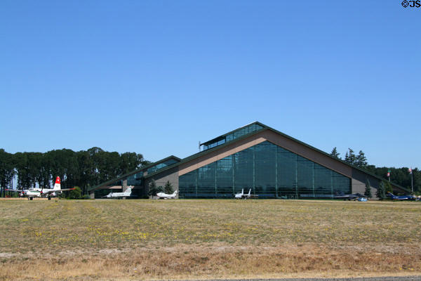 Glass walled building of Evergreen Aviation & Space Museum (2001) (500 NE Capt. Michael King Smith Way). McMinnville, OR. Architect: Scott/Edwards Architecture.