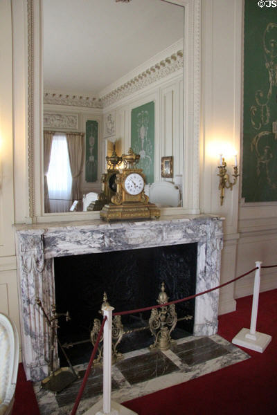 Guest Bedroom fireplace with mantle clock at The Breakers. Newport, RI.