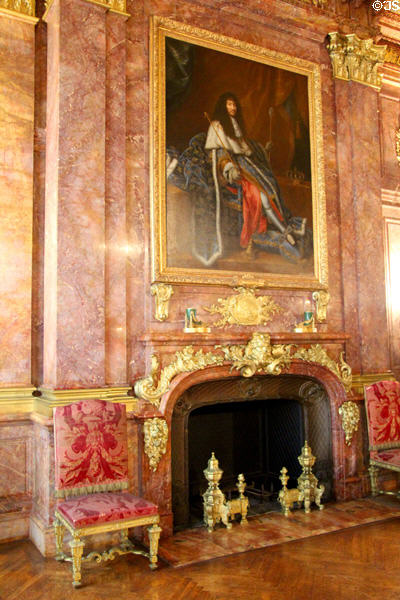 Dining room fireplace with portrait of Louis XIV (late 17thC) attrib. to Henri Testelin at Marble House. Newport, RI.