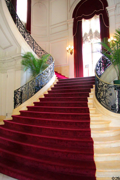 Staircase with red carpet at Rosecliff. Newport, RI.